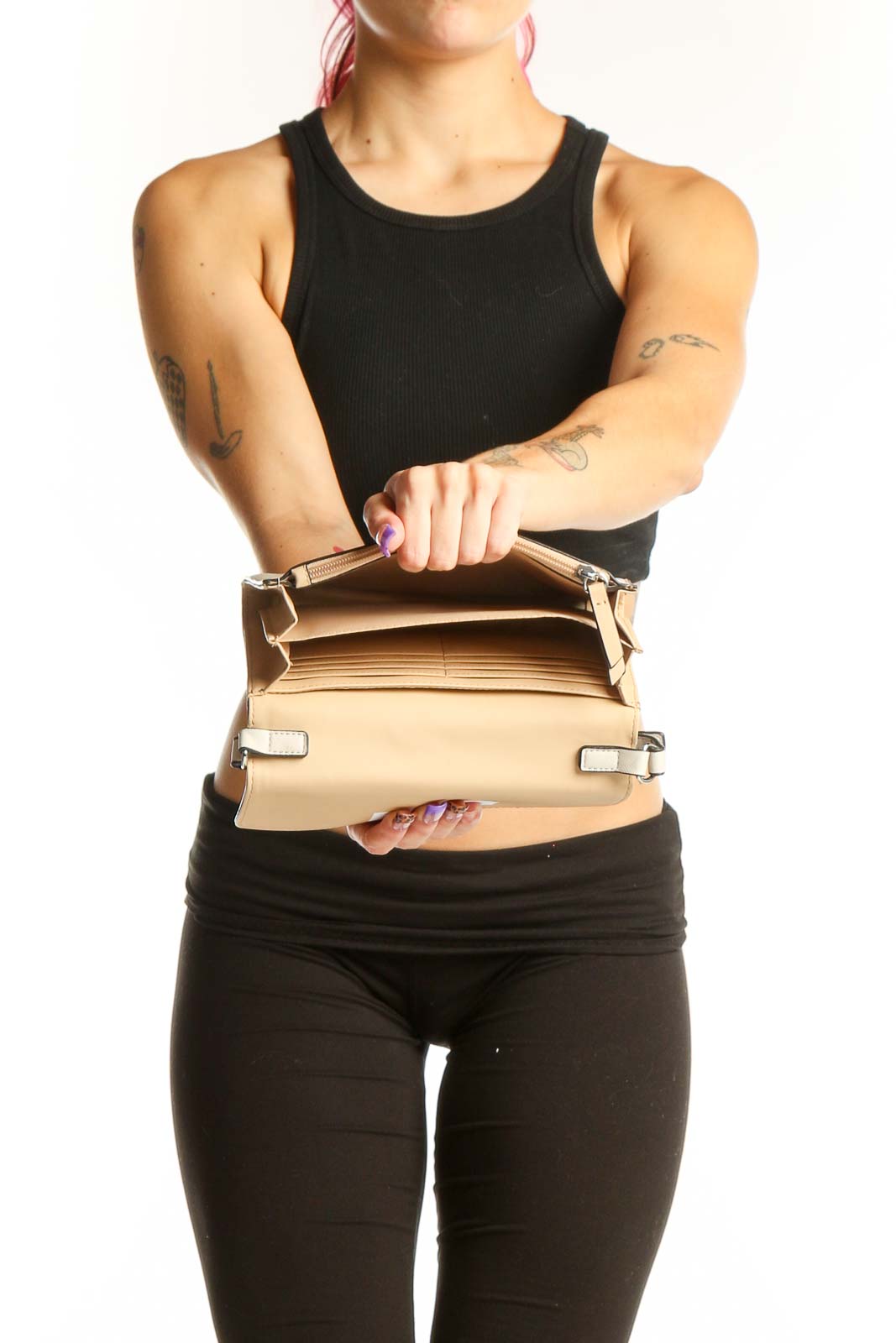 Back view of Cream Guess Crossbody Wallet Bag worn as crossbody style with adjustable shoulder strap