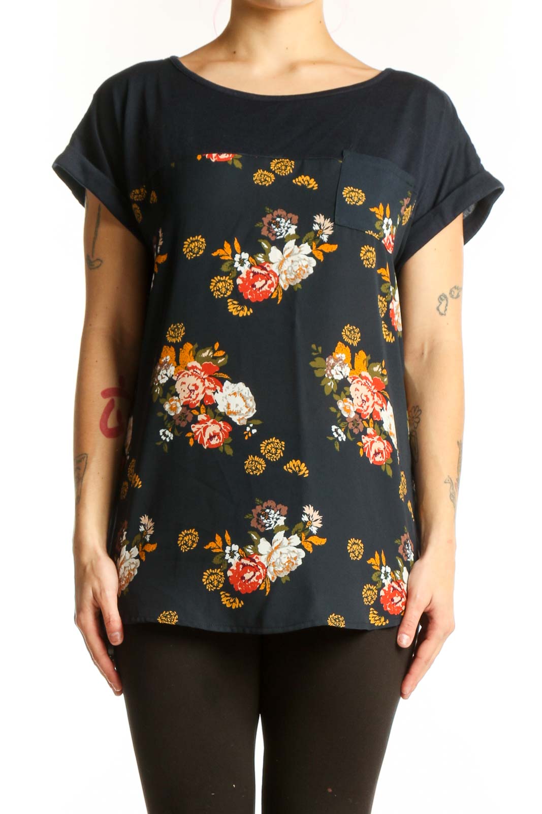 Black floral print short sleeve top by Mason & Belle with red, orange, white, and golden yellow botanical flowers, relaxed fit