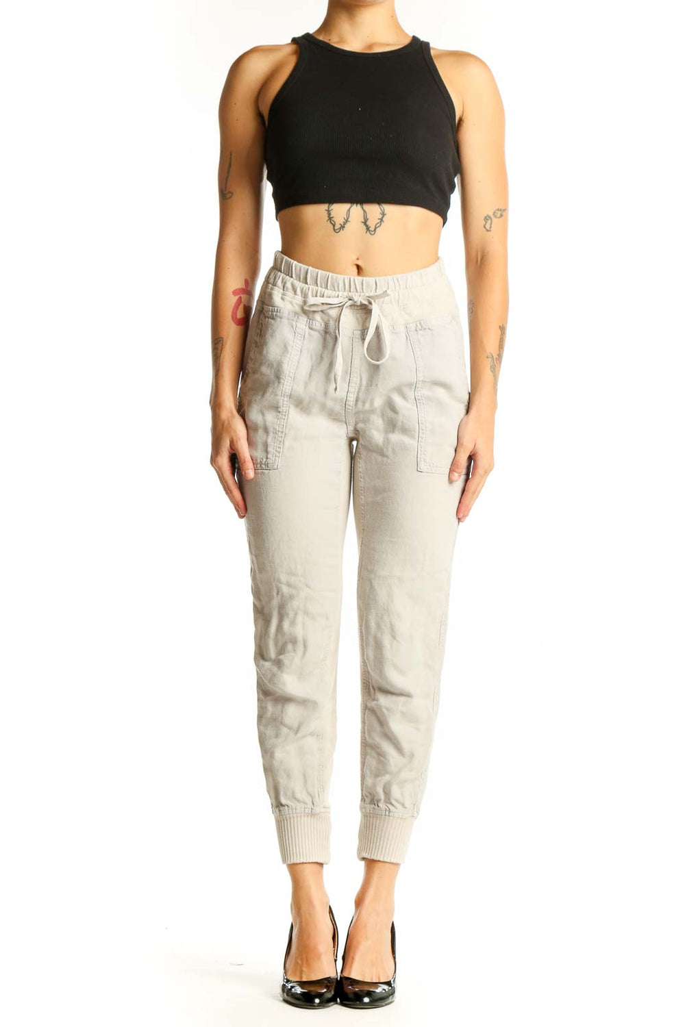 Front view of beige cotton jogger pants with drawstring waist