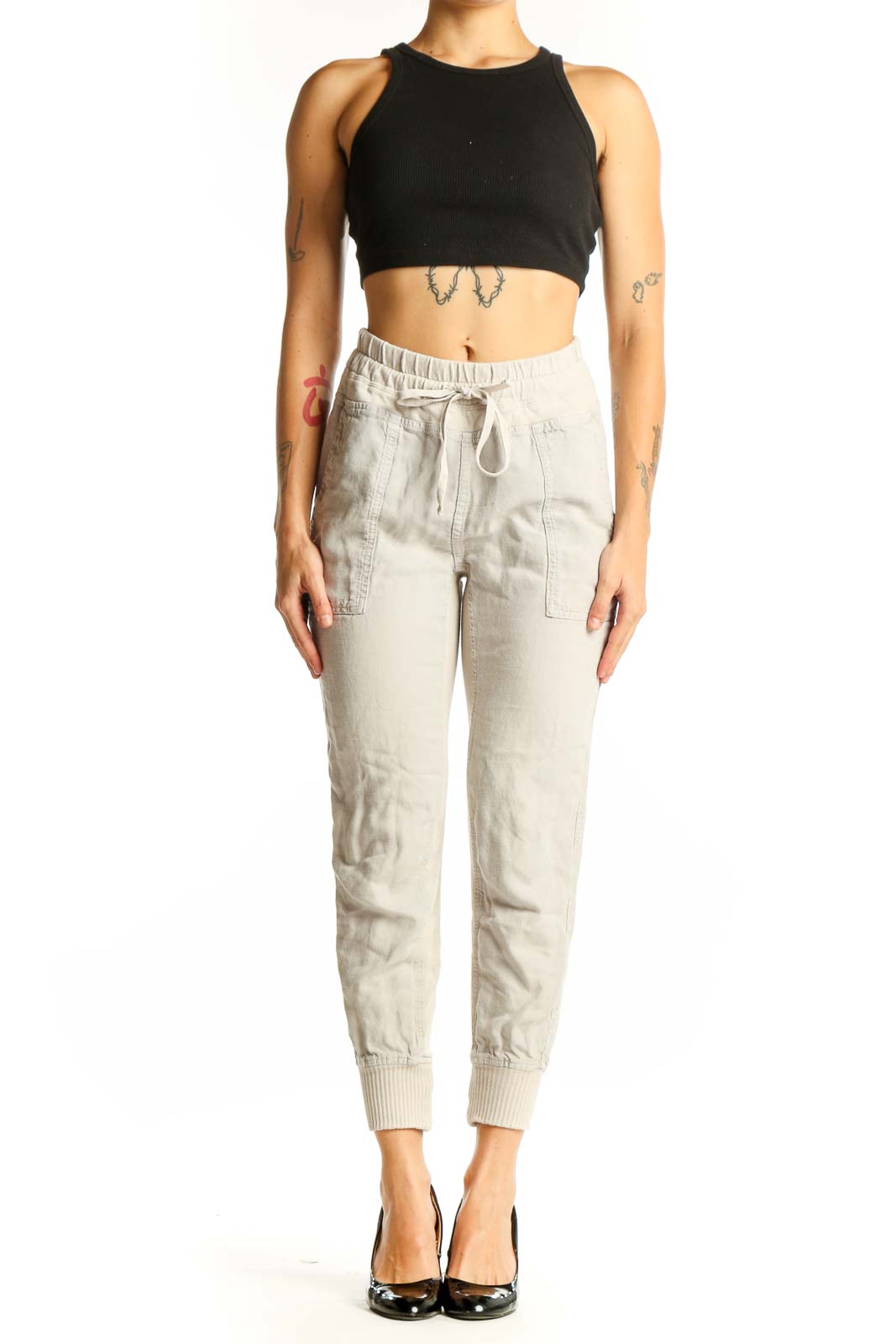Front view of beige cotton jogger pants with drawstring waist
