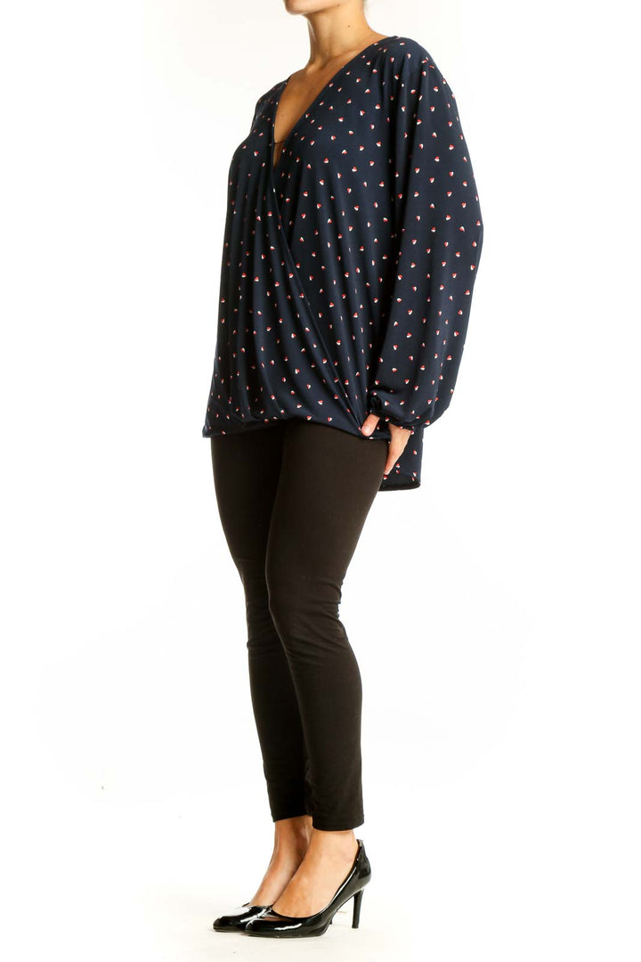 Front view of Banana Republic navy polka dot wrap blouse with V-neckline