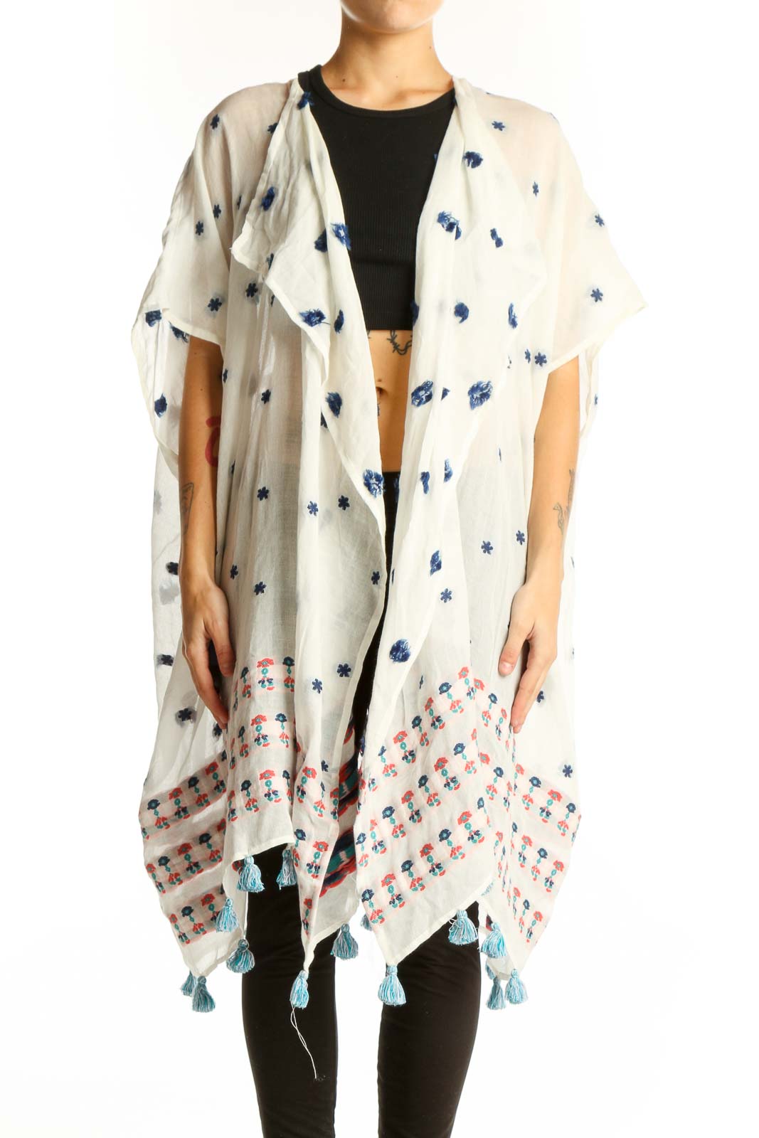 Front view of white J.Crew kimono jacket with blue floral print and tassels