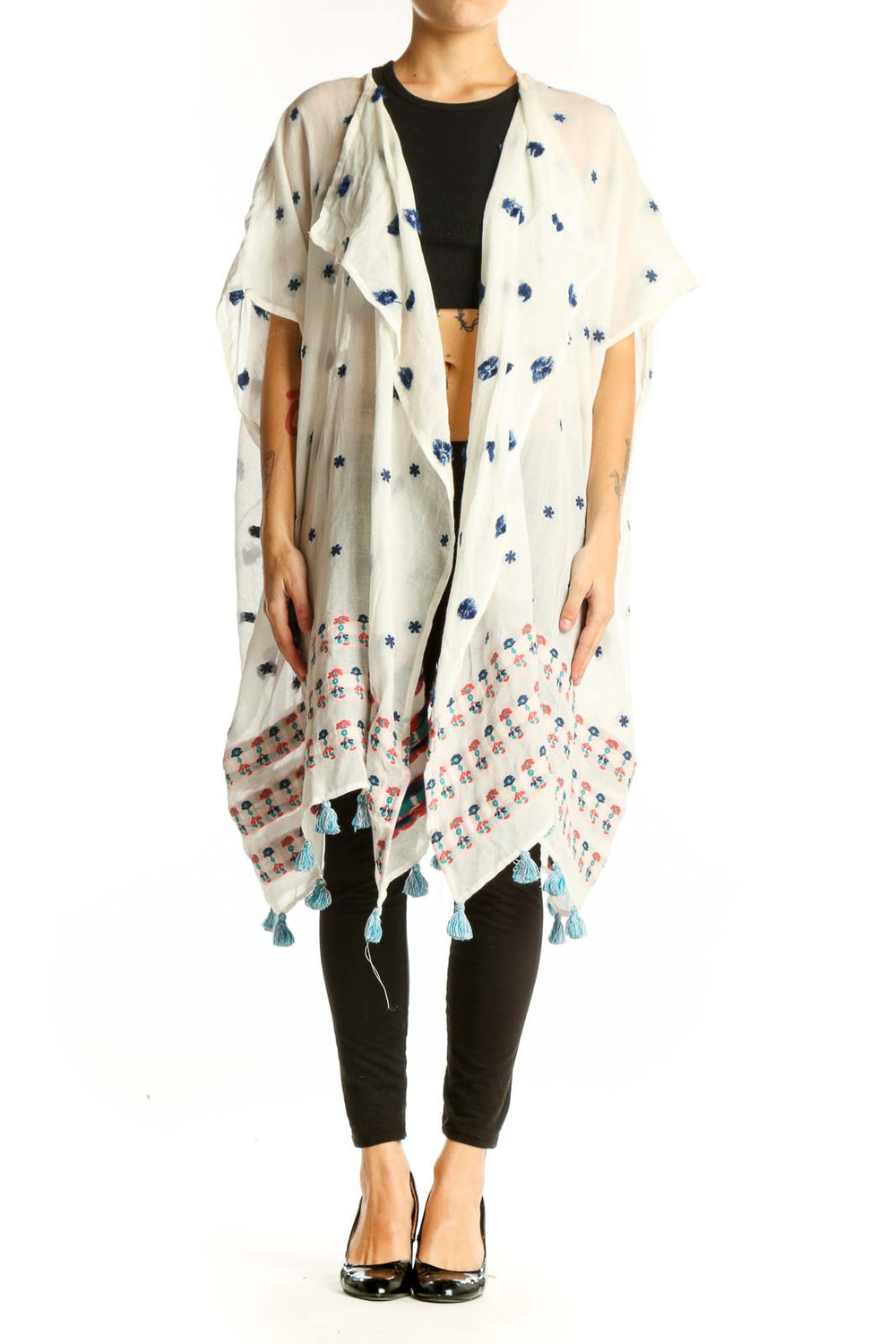 Front view of white J.Crew kimono jacket with blue floral print and tassels