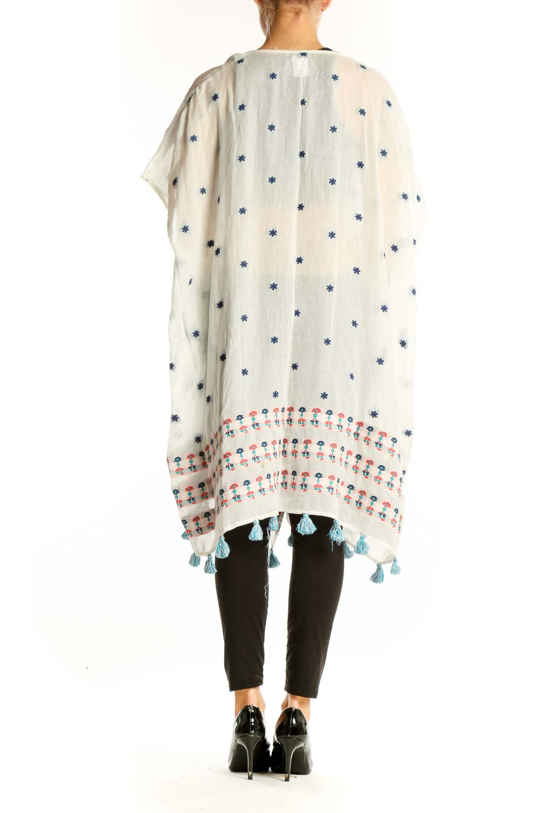 Side view of white J.Crew kimono jacket showing floral print and tassel details