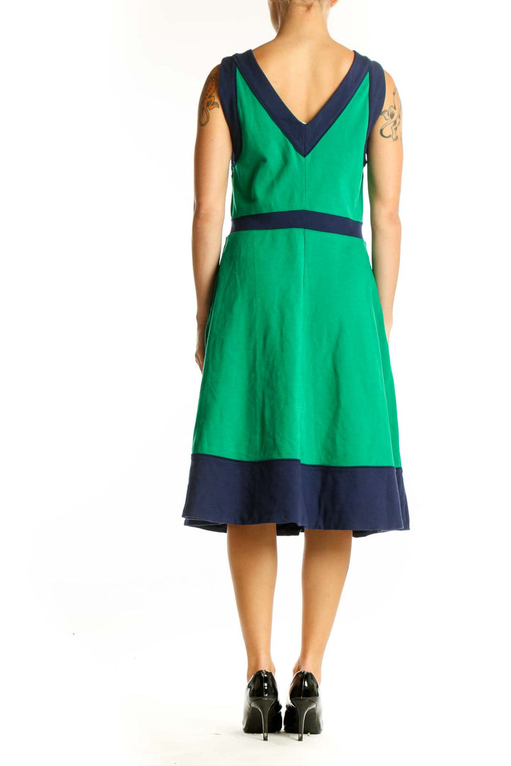 Side view of green sleeveless dress with navy trim and pockets from Lands' End