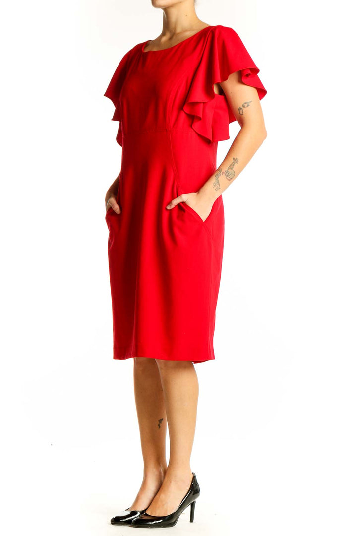 Front view of red Calvin Klein cocktail dress with ruffled sleeves