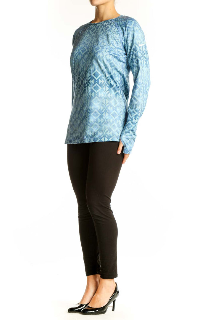 Front view of blue geometric print Nike Pro long sleeve athletic top