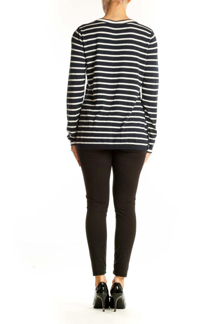 Side view of Talbots navy and white striped V-neck sweater on model with black pants