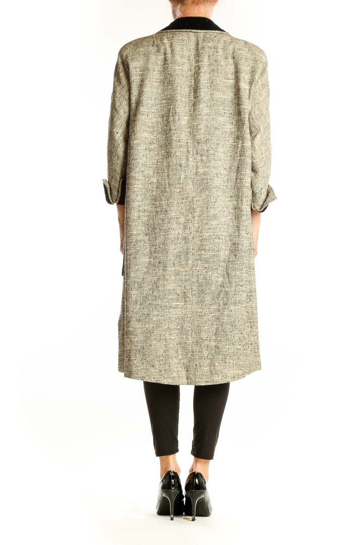 Side view of Roth Moor beige textured long coat showing patch pocket