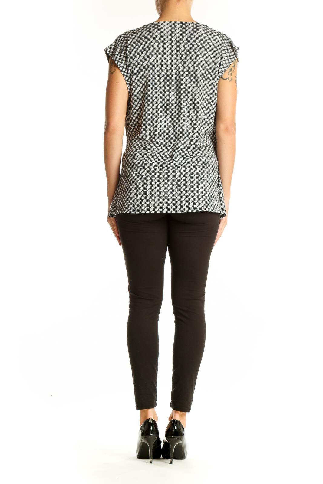 Side view of Ann Taylor houndstooth wrap top showing asymmetrical hemline