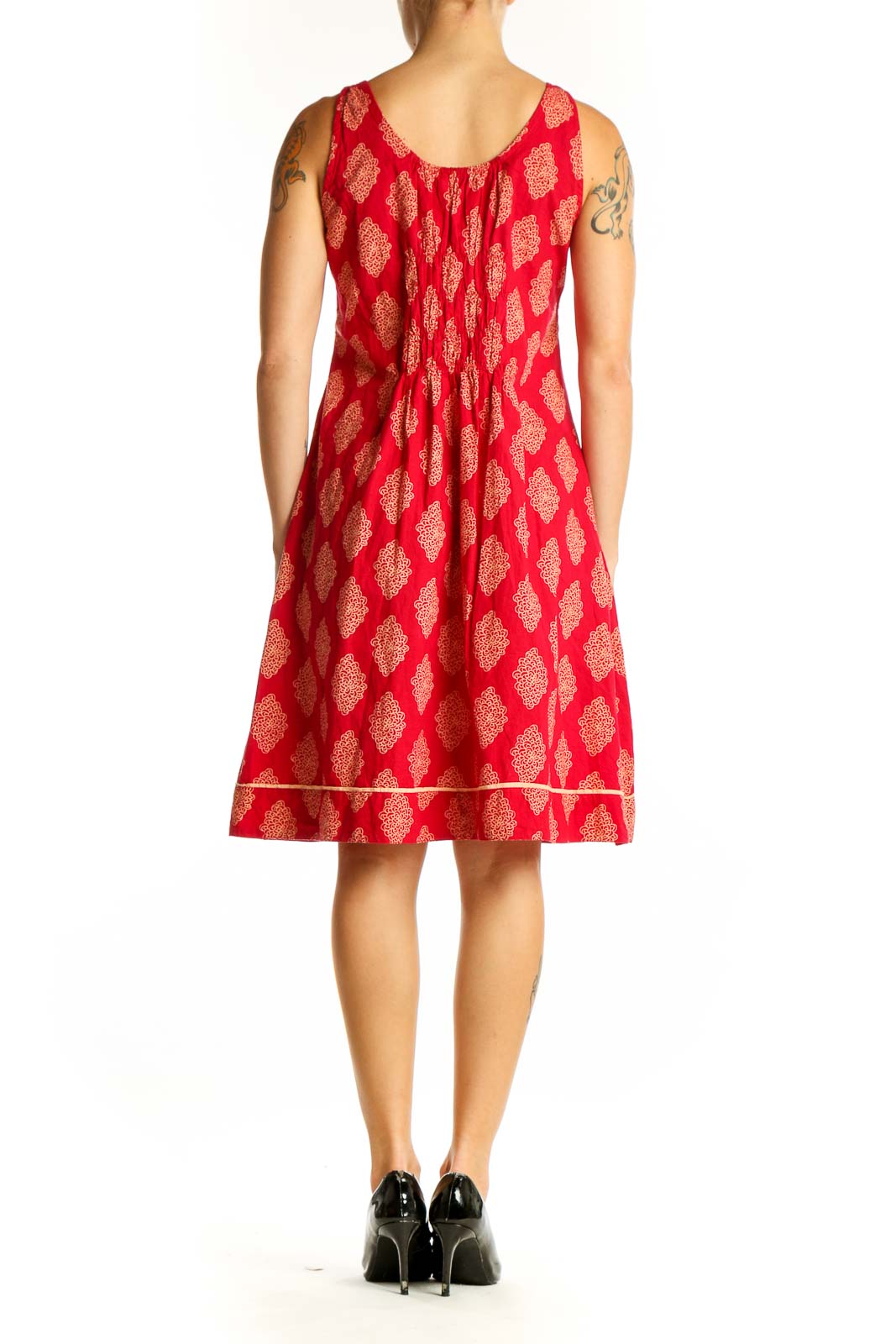 Side view of red floral print sundress showing A-line silhouette