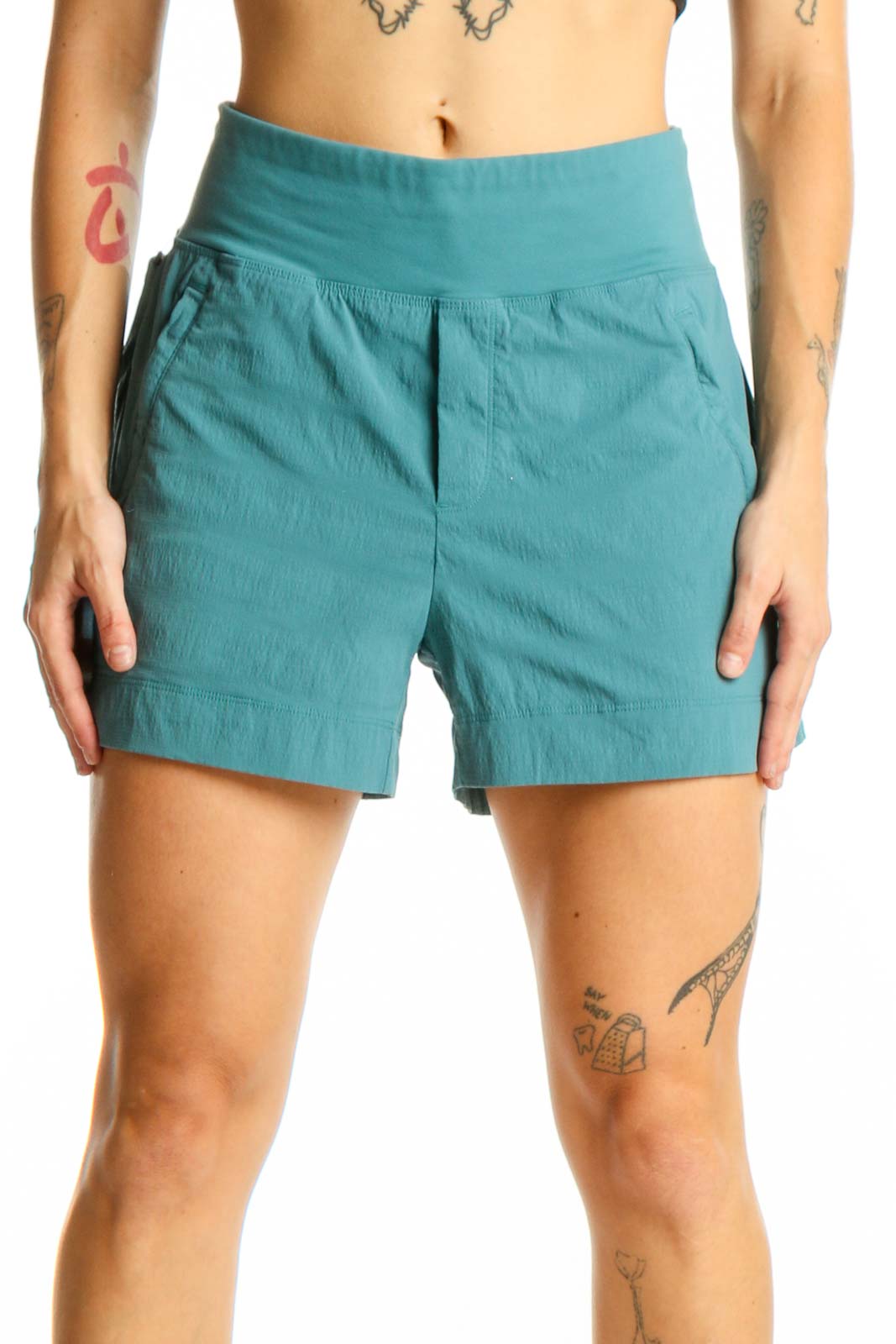 Front view of teal Athleta high-rise athletic shorts