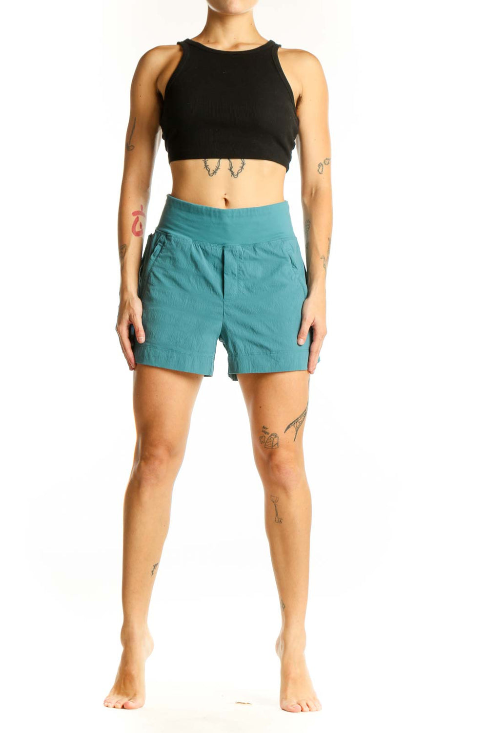 Front view of teal Athleta high-rise athletic shorts