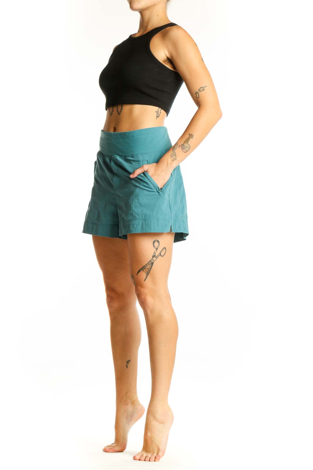 Front view of teal Athleta high-rise athletic shorts