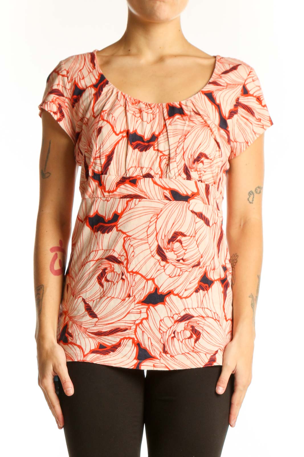 Front view of Ann Taylor coral floral print top with ruffle neckline