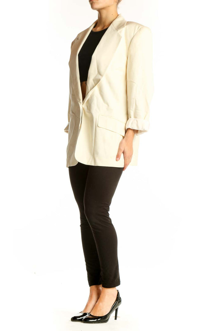 Front view of Ann Taylor cream oversized blazer with rolled-up sleeves