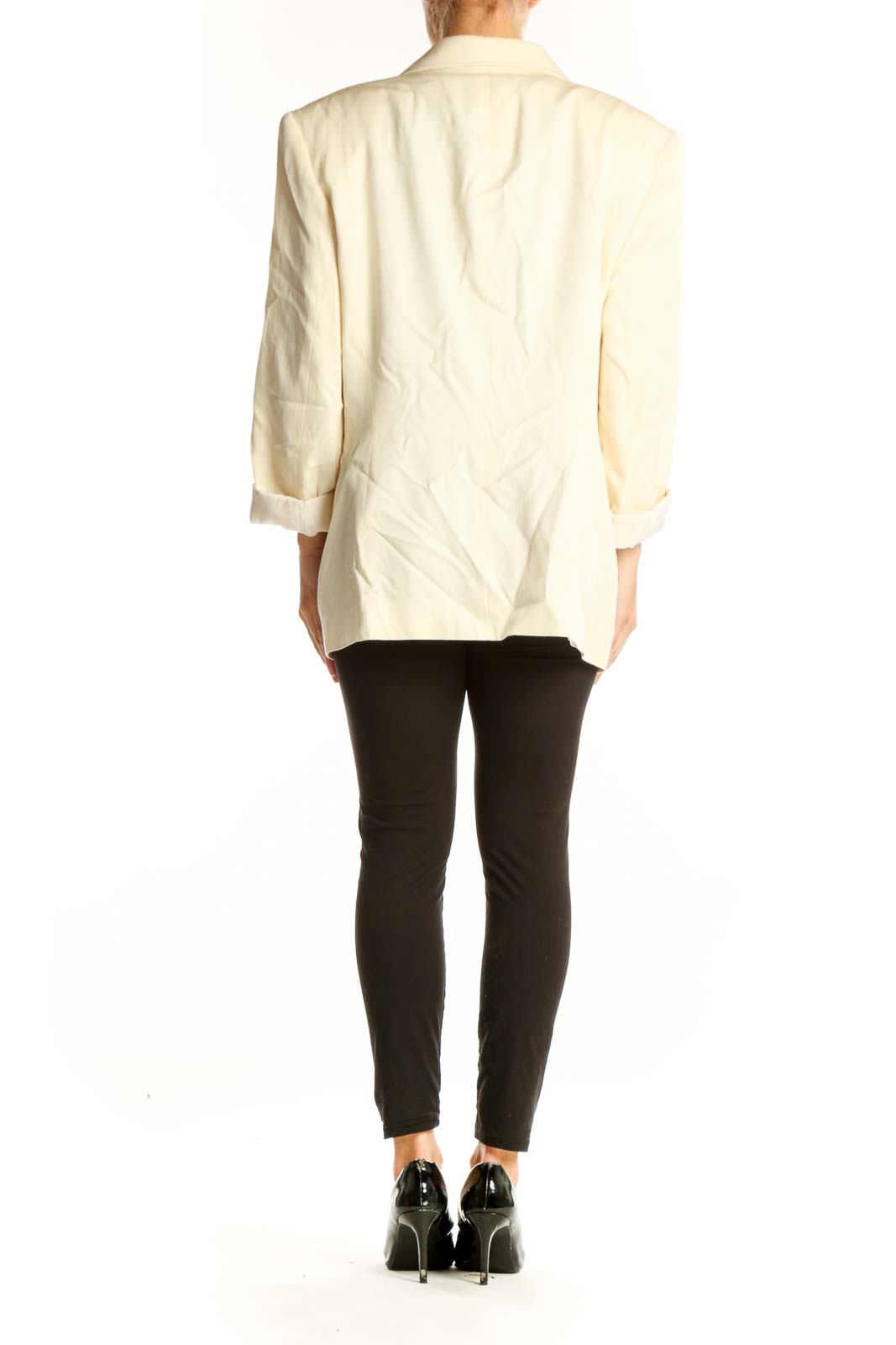 Side view of Ann Taylor cream oversized blazer on model with black outfit