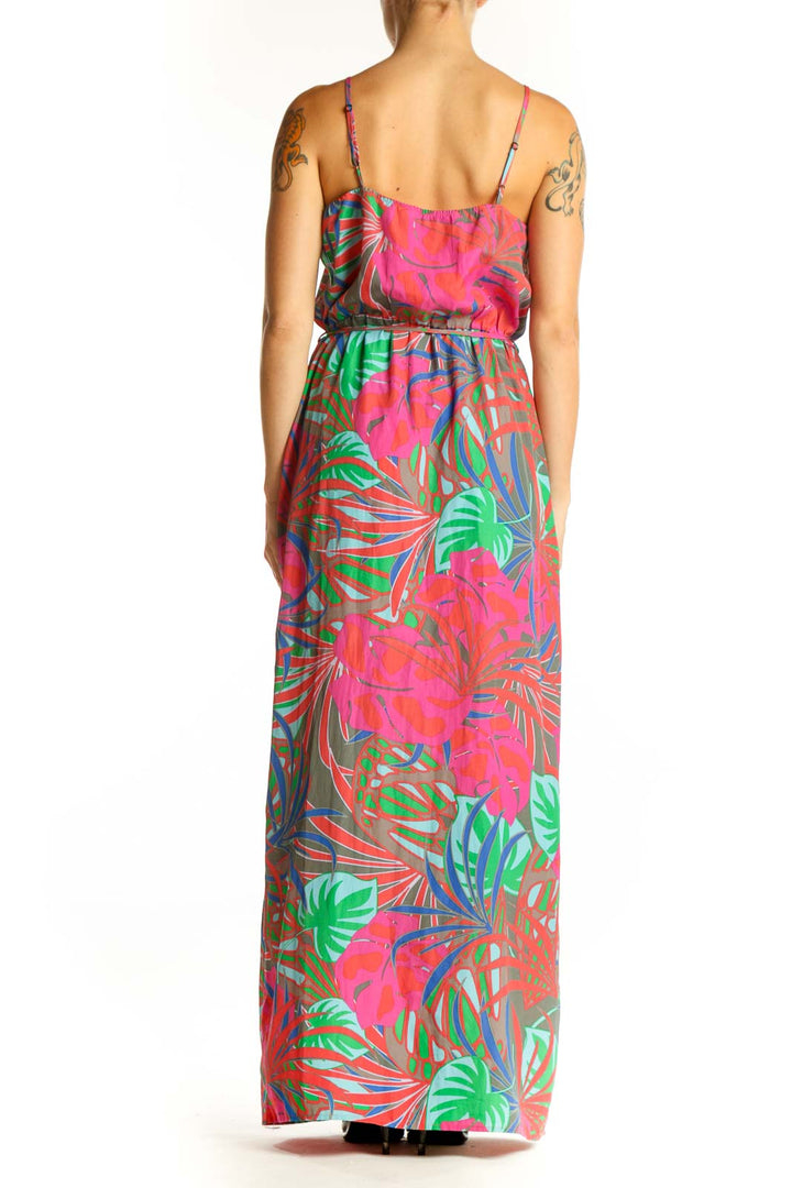Side view of pink tropical print maxi dress showing full length and pattern