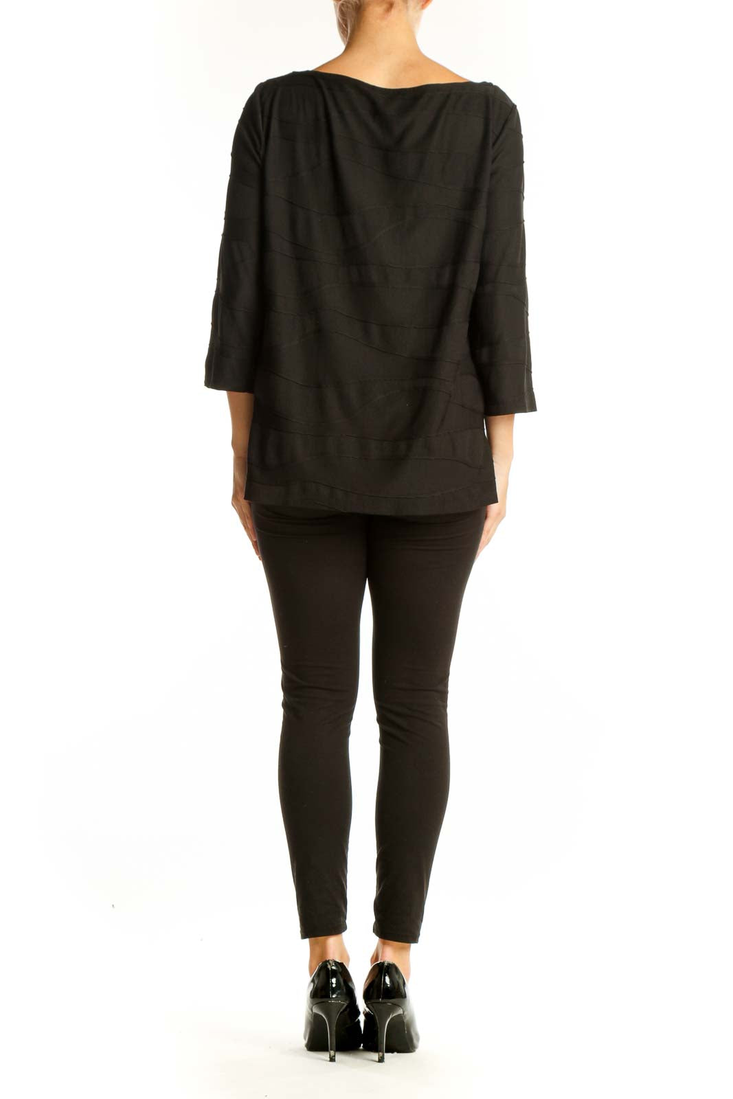 Side view of Ann Taylor black draped top showing relaxed fit and length