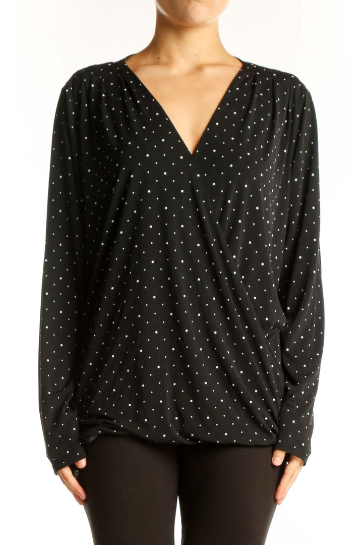 Front view of Banana Republic black polka dot V-neck wrap top