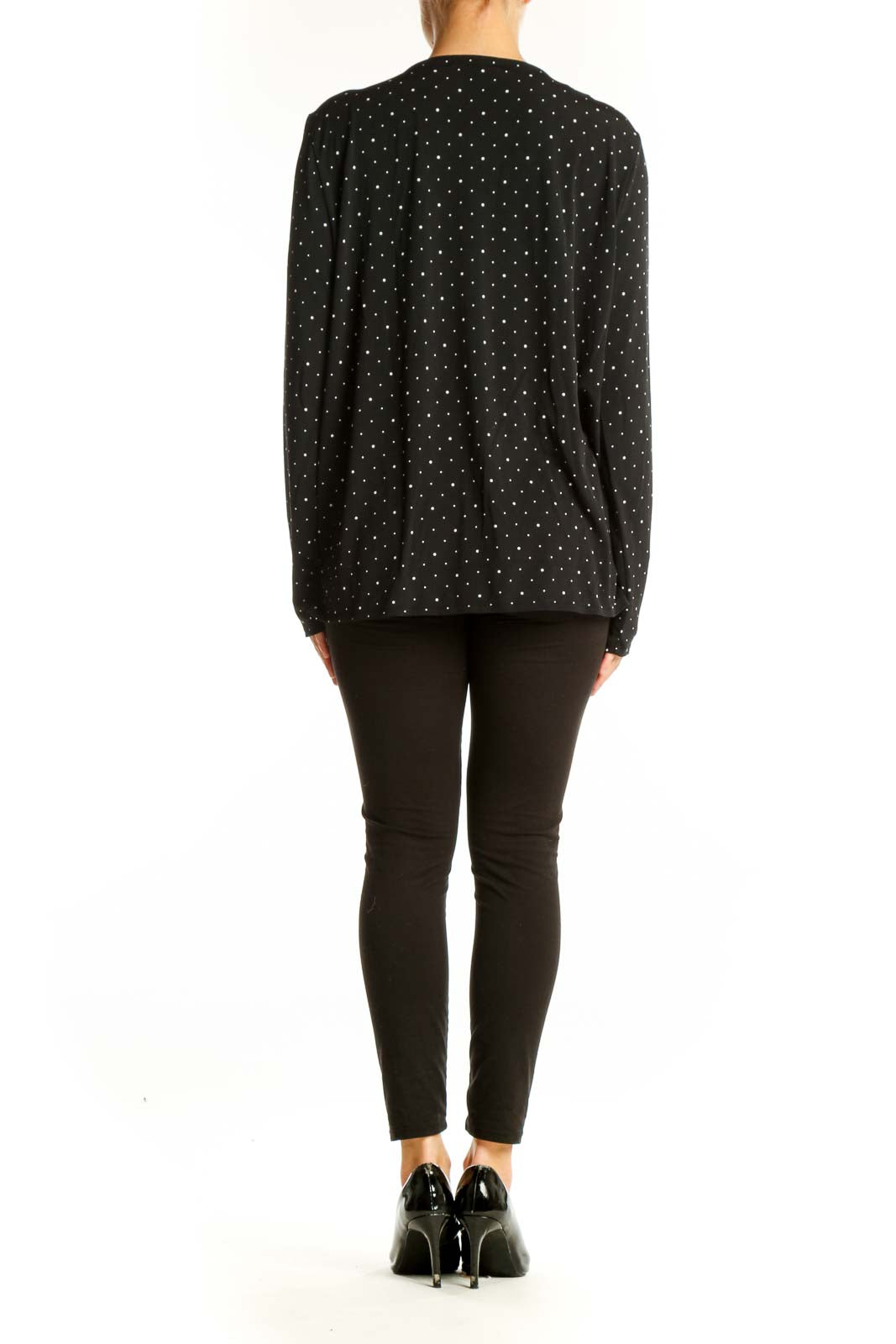 Side view of Banana Republic black polka dot V-neck wrap top on model