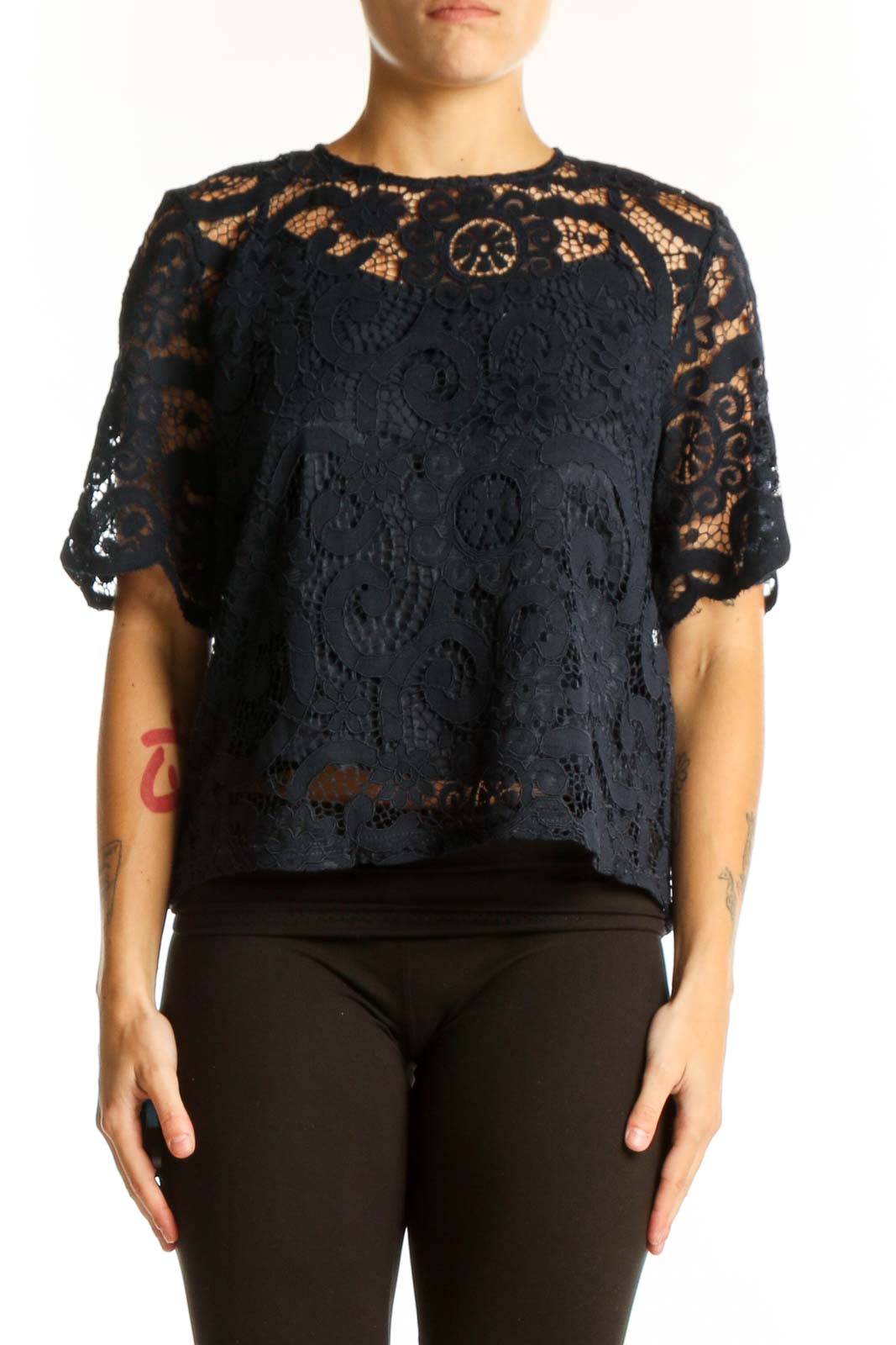 Front view of Nanette Lepore black lace top with floral overlay and short sleeves