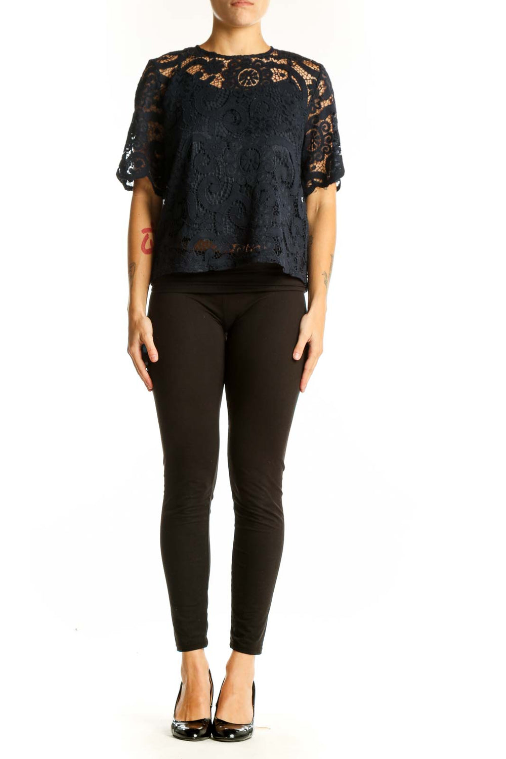 Front view of Nanette Lepore black lace top with floral overlay and short sleeves