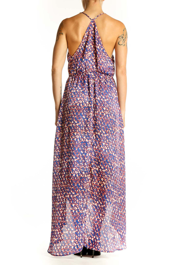 Side view of purple floral print high-low maxi dress showing dramatic back hem