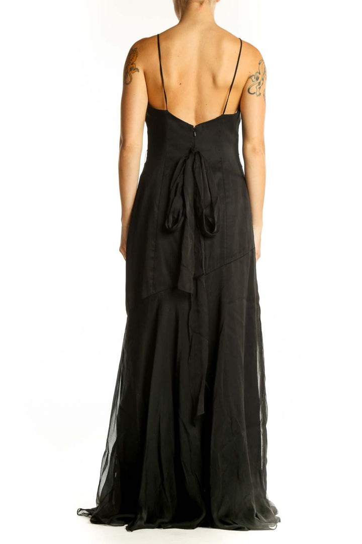 Side view of black Belsoie floor-length gown showing mermaid silhouette