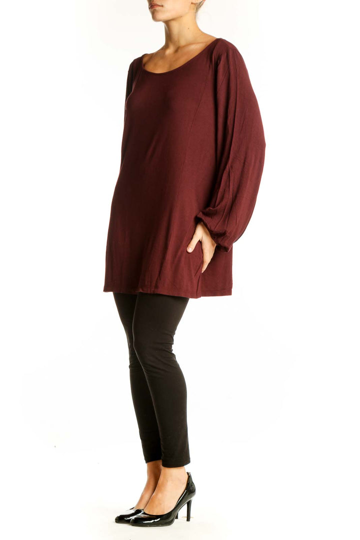 Front view of Ann Taylor burgundy long sleeve tunic top on model