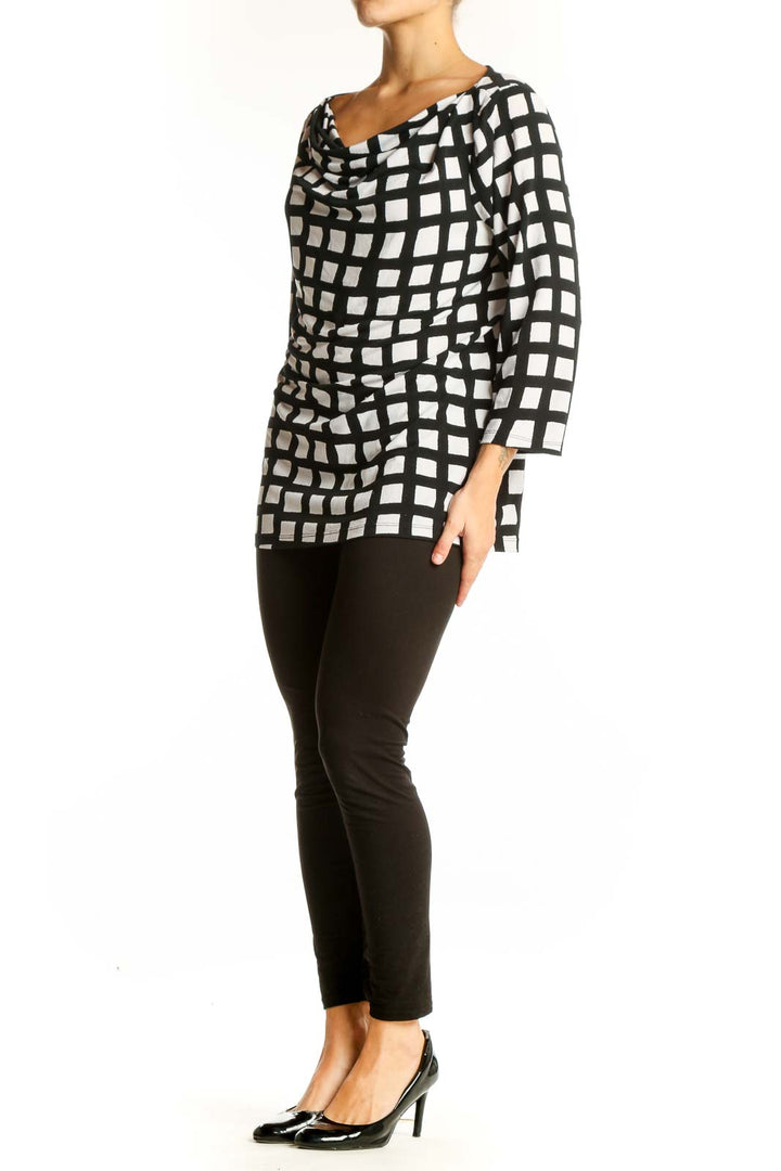 Front view of Ann Taylor black and white geometric print top with cowl neck