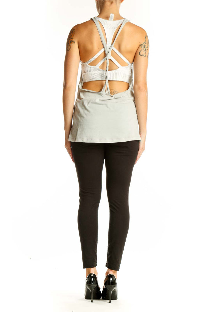 Side view of light gray Lululemon racerback athletic tank top on model