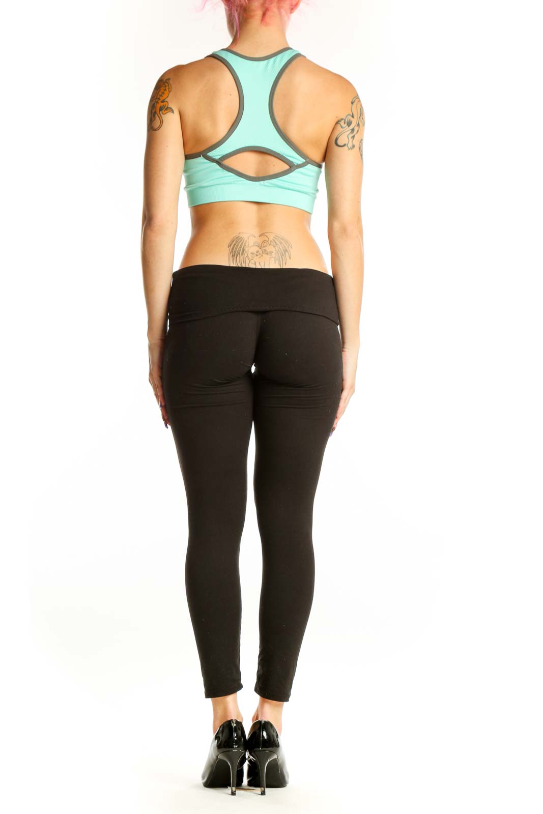Mint green New Balance sports bra with charcoal trim, racerback design, back view on model