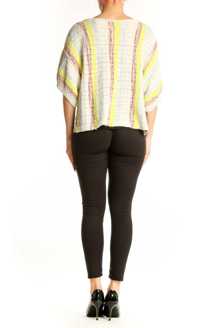 Pilcro cream striped knit top with neon accents, cropped length, back view showing relaxed silhouette