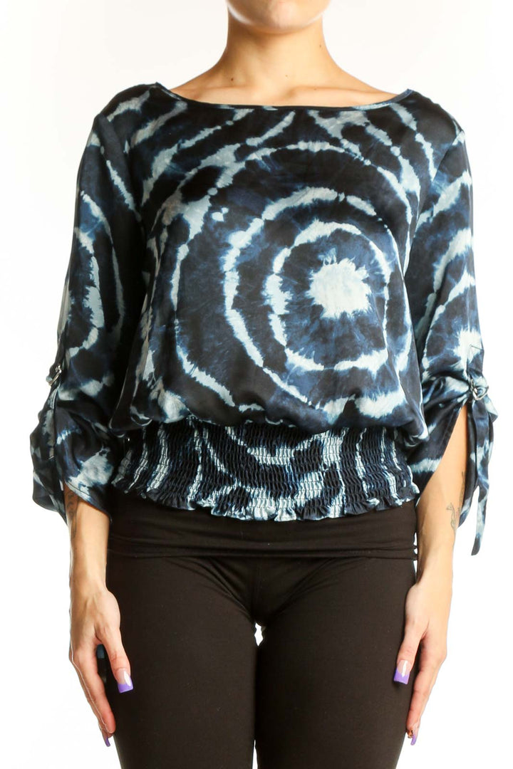 Navy tie-dye spiral print blouse with tie sleeves and gathered waistband, front view