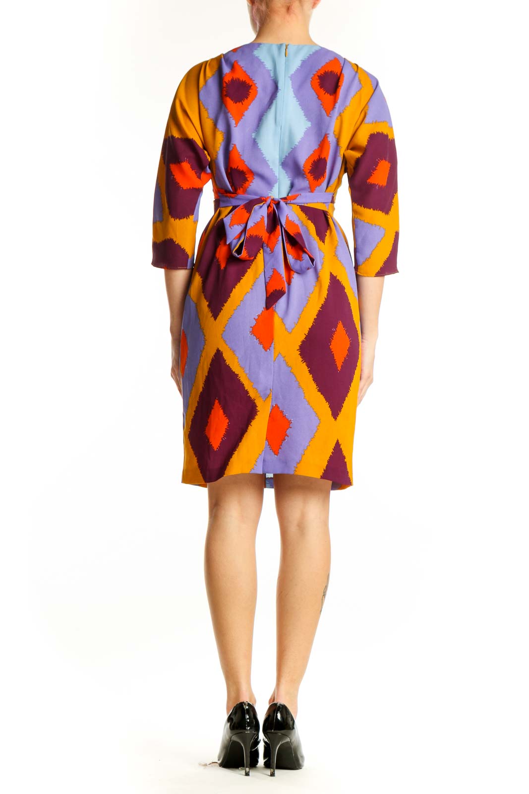 Back view of multicolor geometric print wrap dress showing wrap-front design and three-quarter sleeves by Vince Camuto