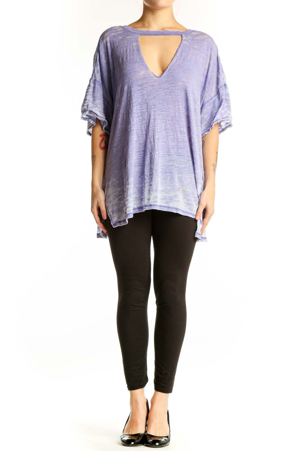 Free People purple cutout V-neck top with ruffled sleeves and asymmetrical hemline, front view on model