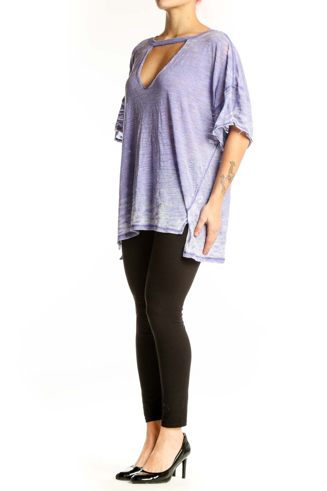 Free People purple cutout V-neck top with ruffled sleeves and asymmetrical hemline, front view on model