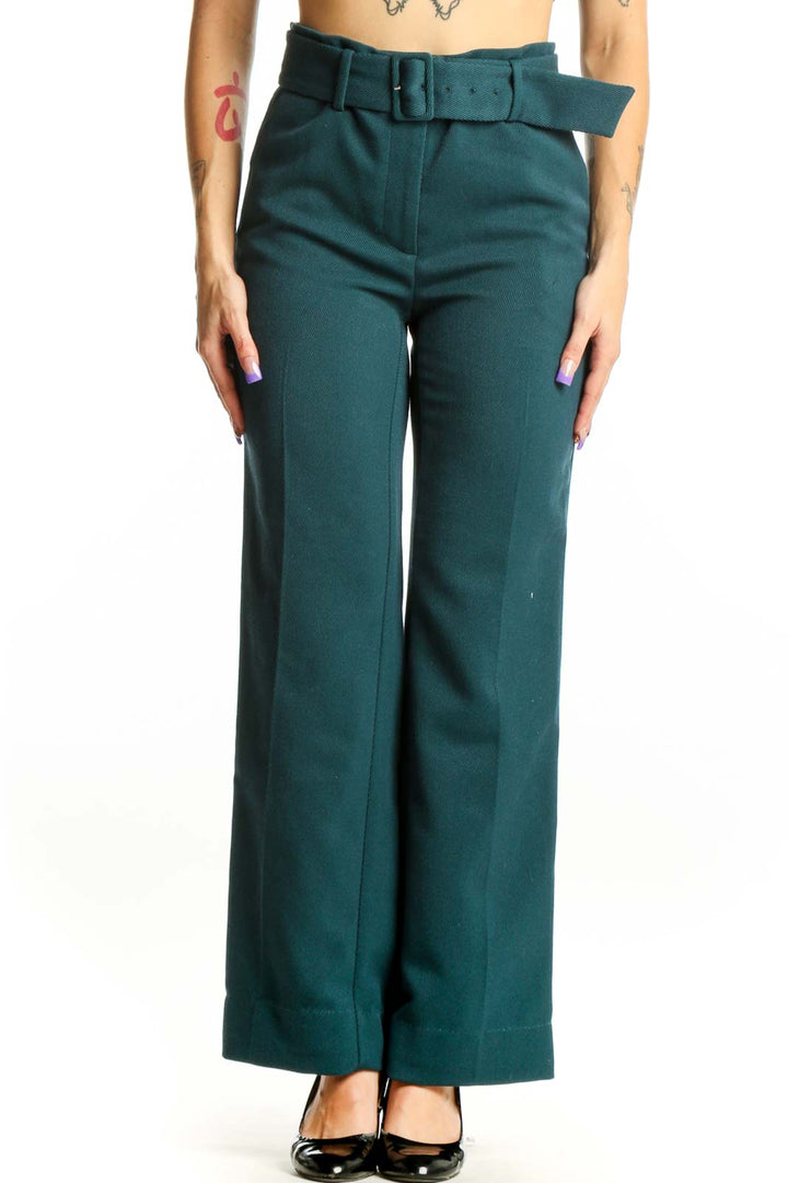 Front view of teal belted wide-leg dress pants with structured waist belt and high-waisted cut