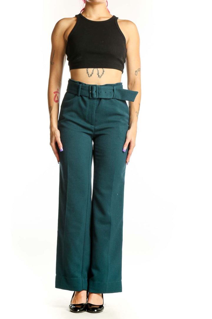 Front view of teal belted wide-leg dress pants with structured waist belt and high-waisted cut