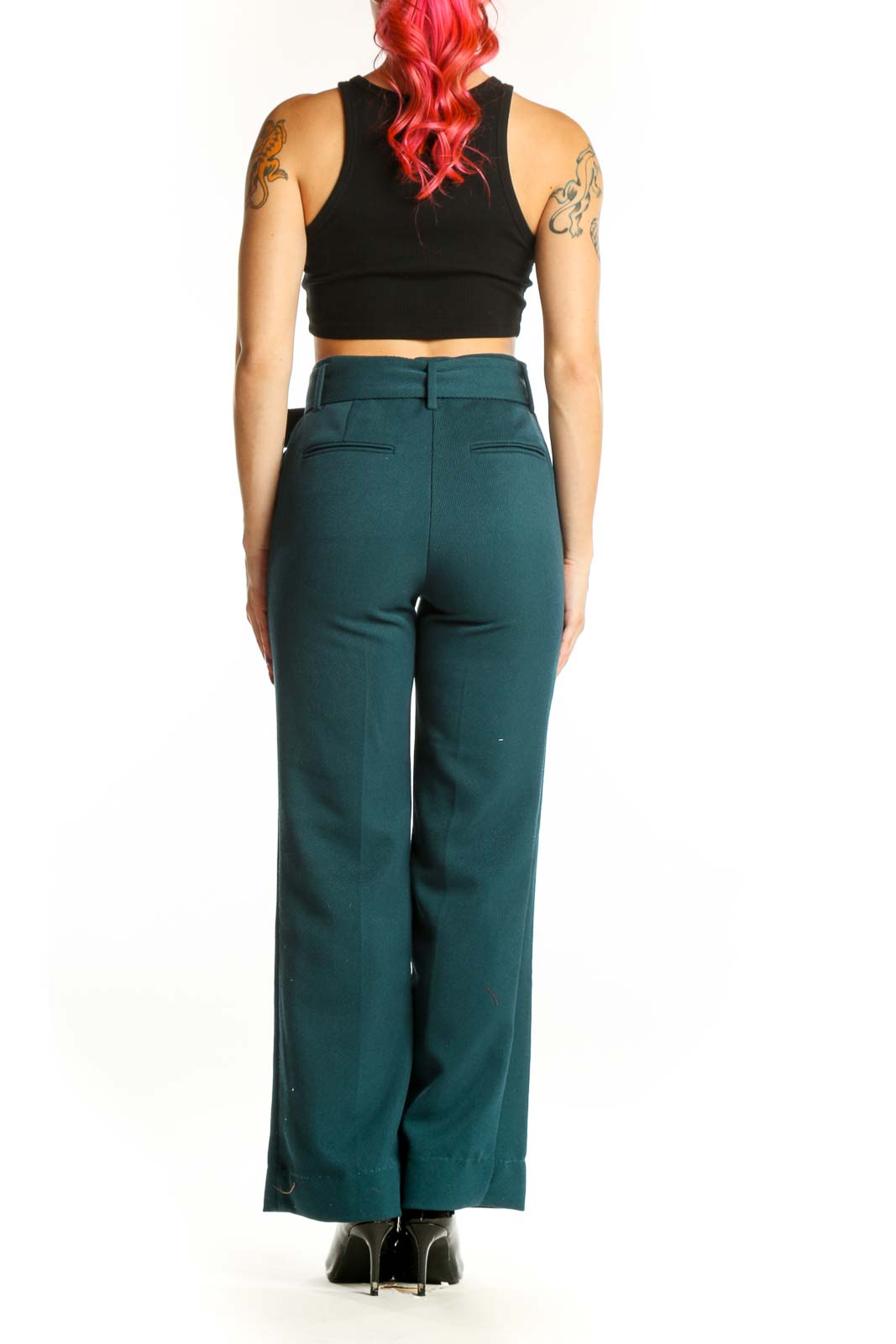 Back view of teal belted wide-leg dress pants showing the elegant drape and fit