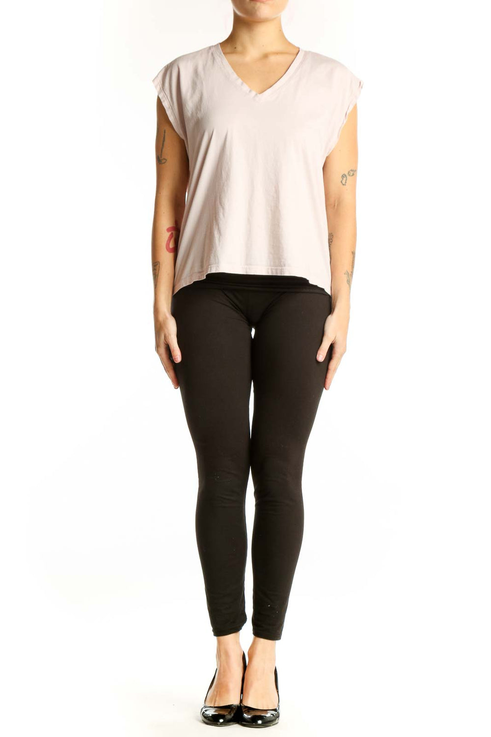 Cream cotton v-neck cap sleeve top with cropped silhouette, front view on model