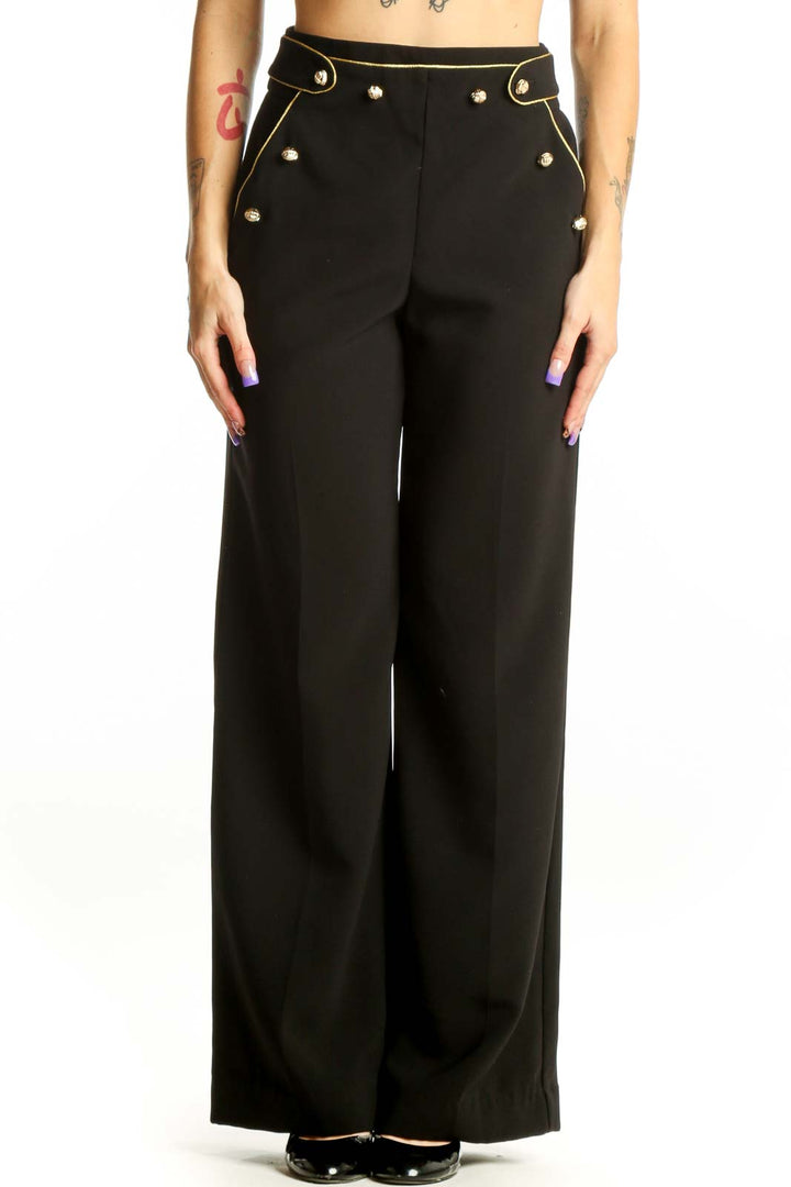 Black wide-leg pants with gold stud details and high-waisted silhouette, front view