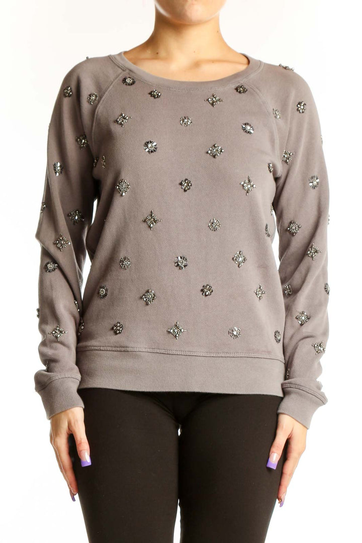Front view of taupe J.Crew cotton sweatshirt with metallic embellished starburst pattern, crew neckline, long sleeves