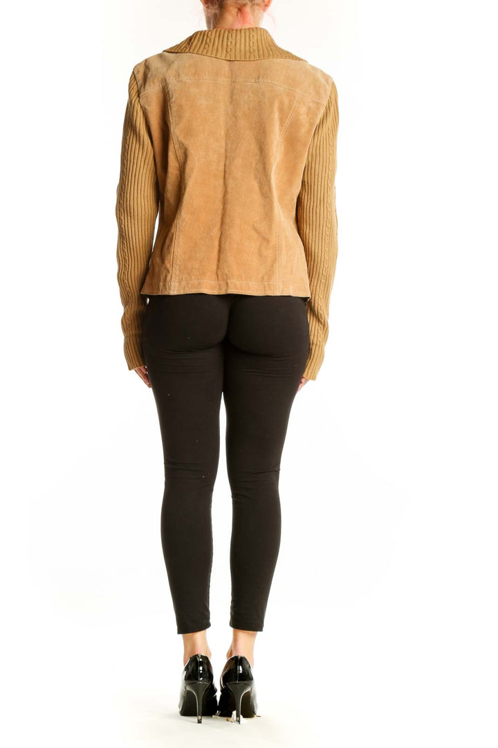 Back view of tan leather jacket with ribbed acrylic sleeves showing fitted silhouette