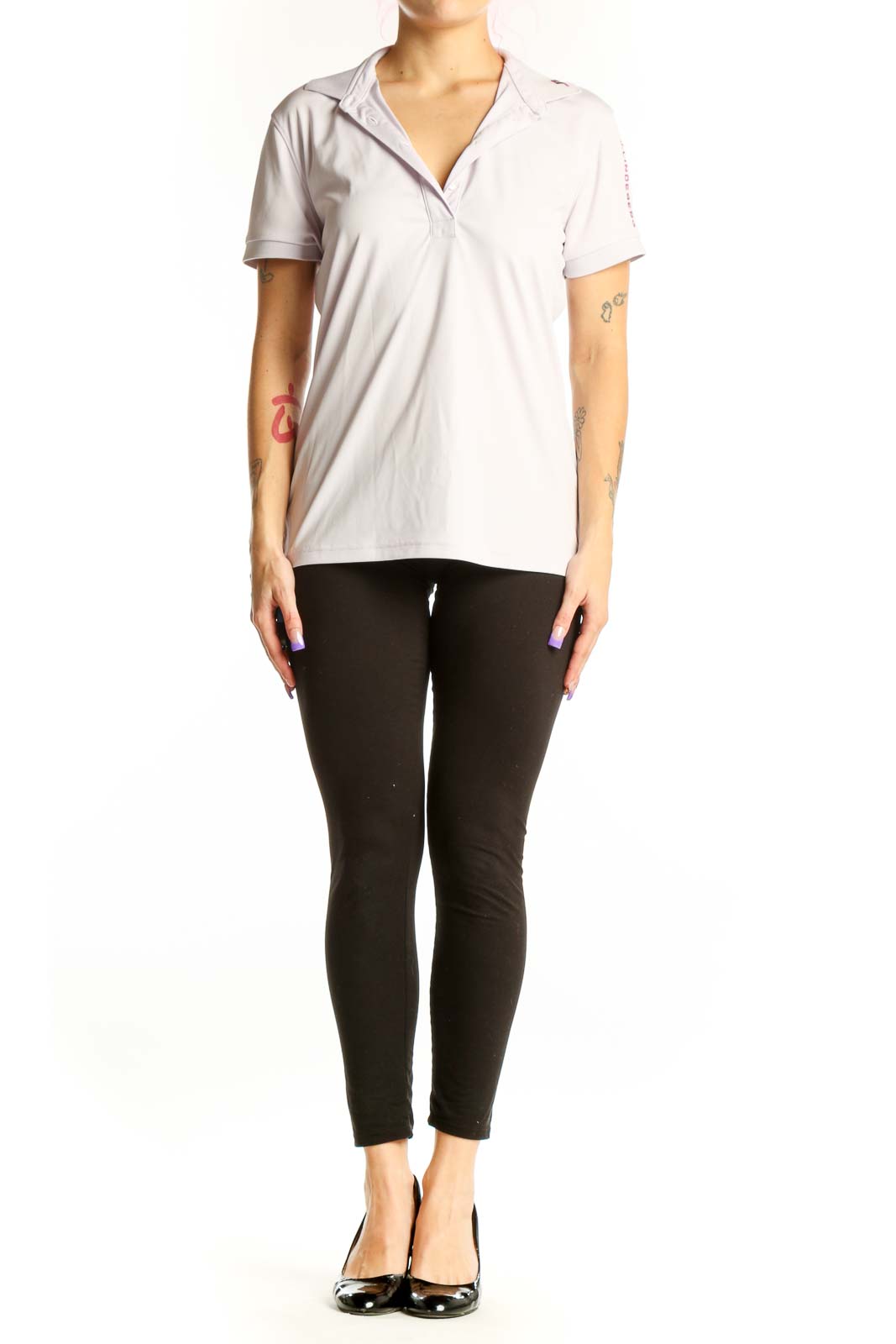 White polo short sleeve top with collar and button-front closure, displayed on model