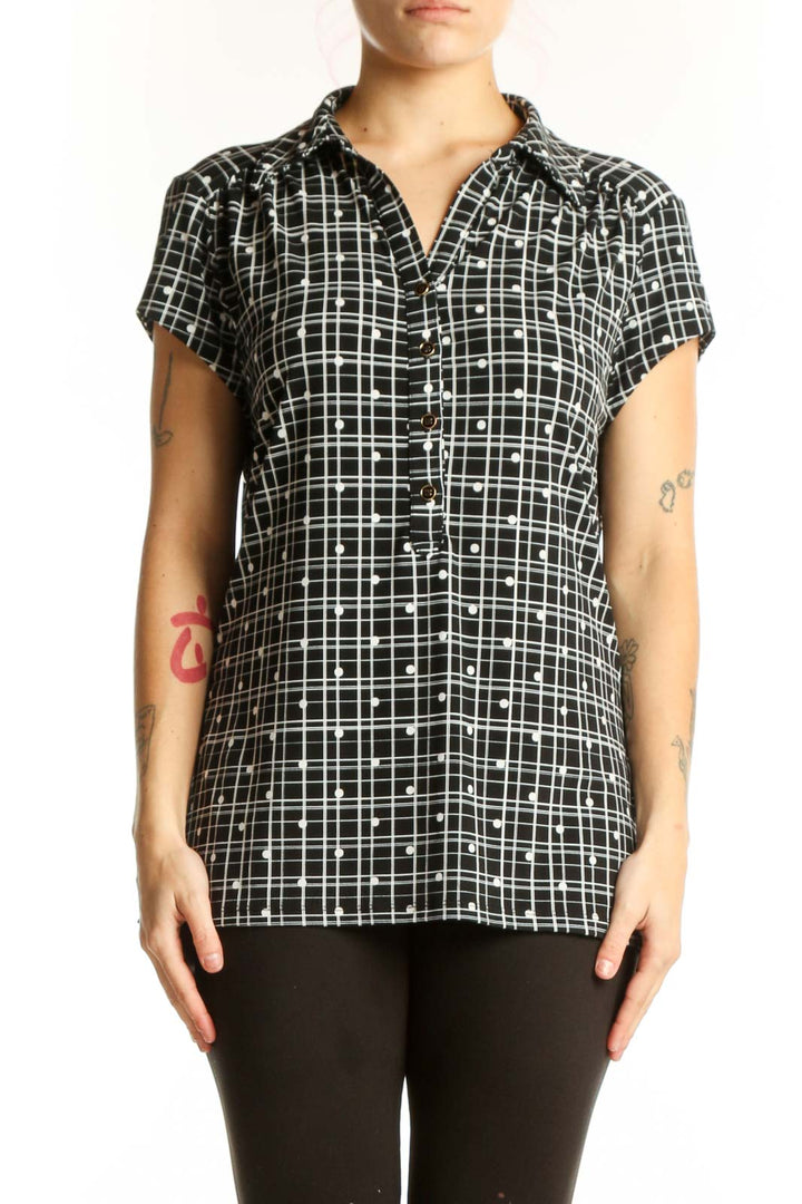 Black and white grid pattern short sleeve button-up shirt with collared neckline, front view