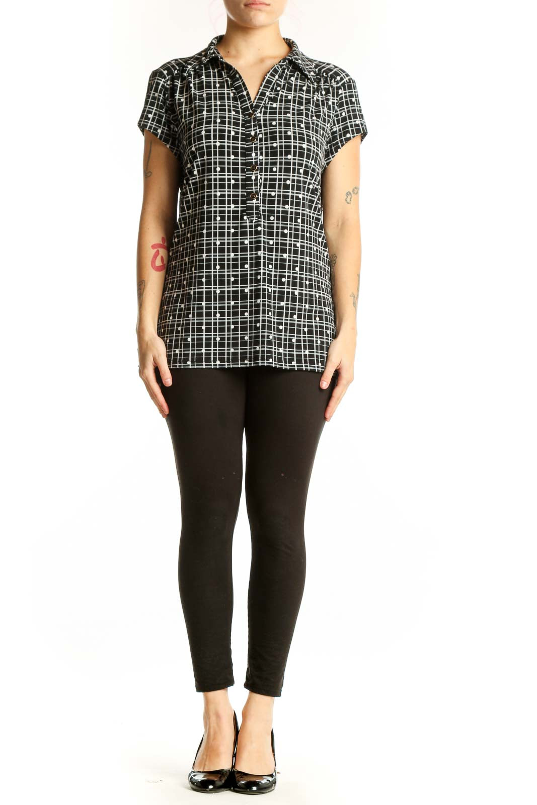 Black and white grid pattern short sleeve button-up shirt with collared neckline, front view