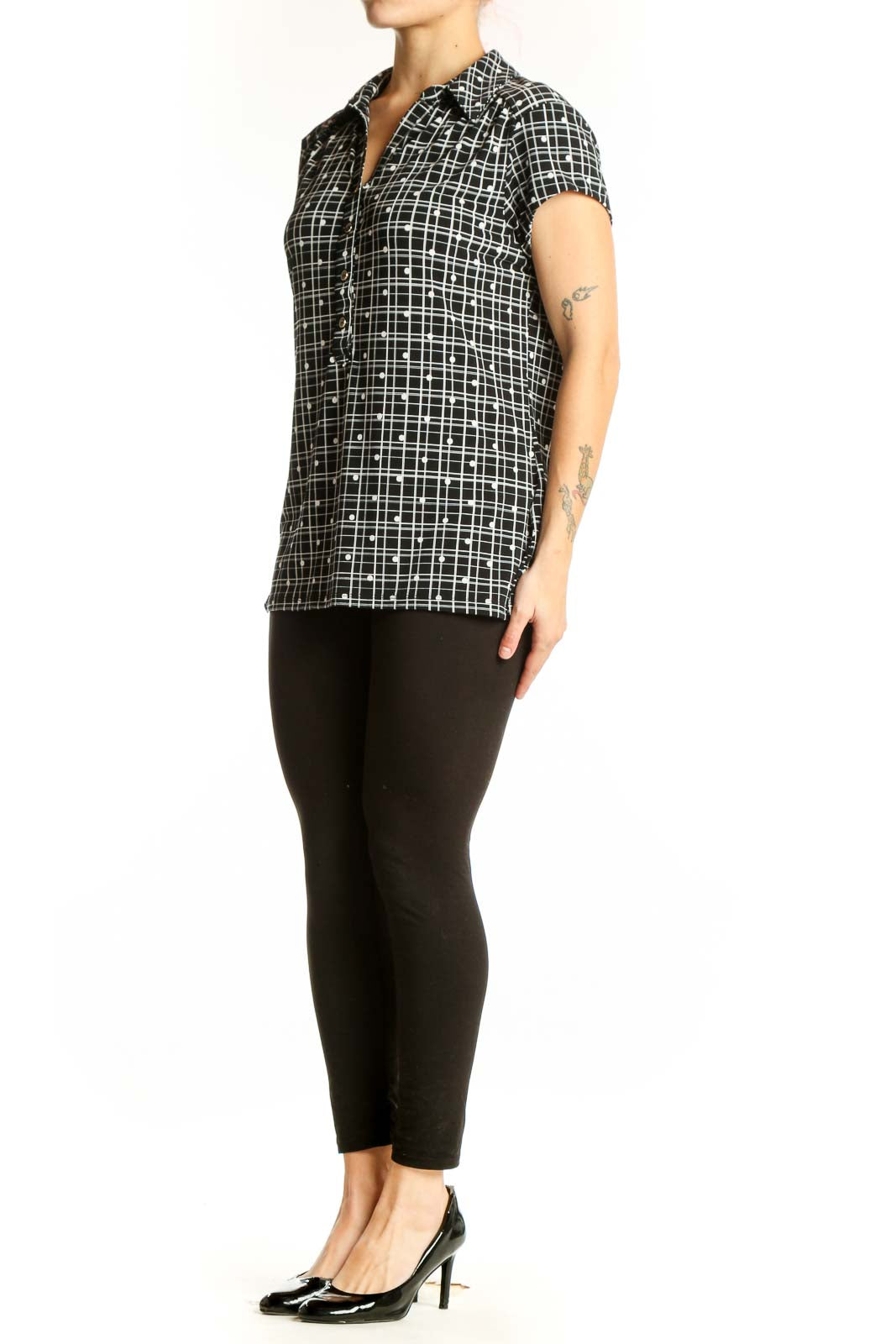 Black and white grid pattern short sleeve button-up shirt with collared neckline, front view