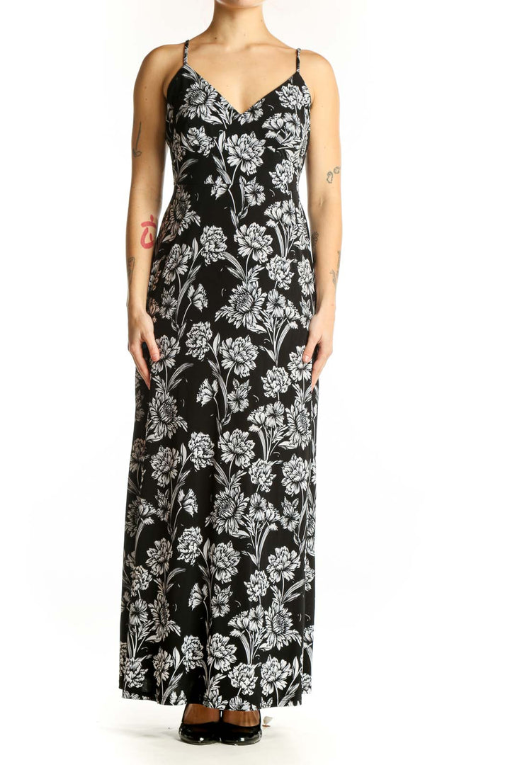 Black and white floral maxi camisole dress with V-neckline and adjustable straps, front view